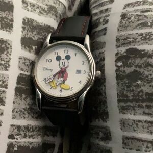 Mickey Mouse ladies wrist match. The watch band is black leather